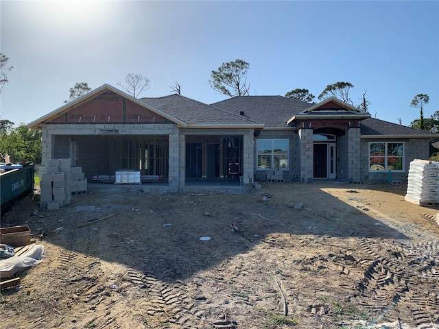 47 Tee View Rd, Rotonda West, FL 33947 - back of house featuring a shingled roof
