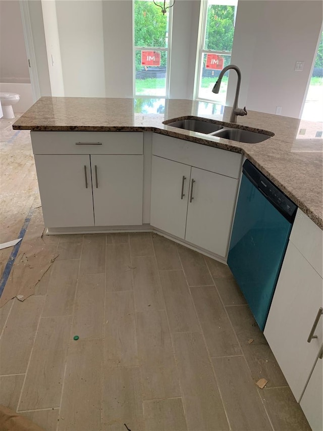 47 Tee View Rd, Rotonda West, FL 33947 - kitchen featuring dishwasher, white cabinetry, light stone countertops, and healthy amount of natural light