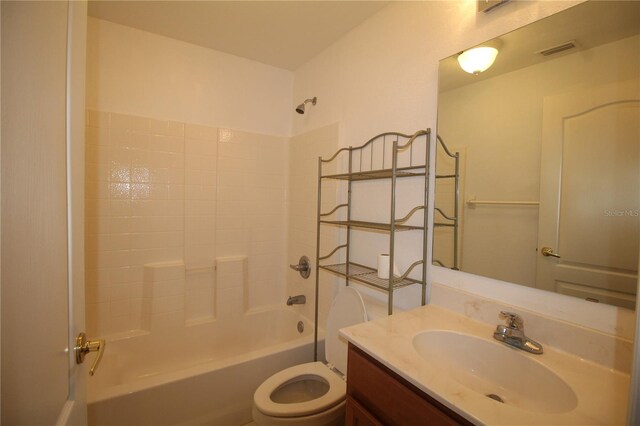 4749 Oakley Rd, North Port, FL 34288 - bathroom featuring visible vents, toilet, vanity, and bathing tub / shower combination