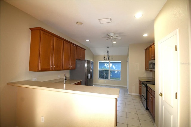 4749 Oakley Rd, North Port, FL 34288 - kitchen with light tile patterned floors, a peninsula, recessed lighting, appliances with stainless steel finishes, and brown cabinets