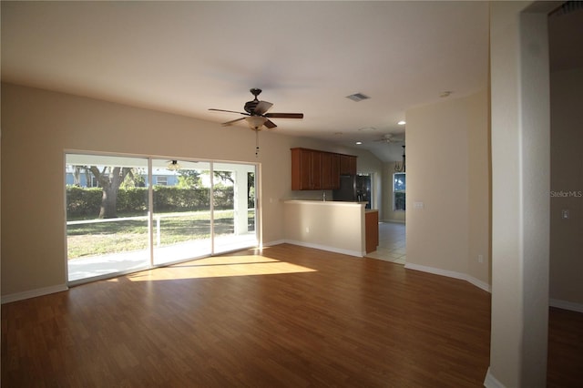 4749 Oakley Rd, North Port, FL 34288 - unfurnished living room with visible vents, ceiling fan, wood finished floors, and baseboards