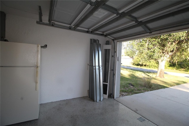 4749 Oakley Rd, North Port, FL 34288 - garage with freestanding refrigerator