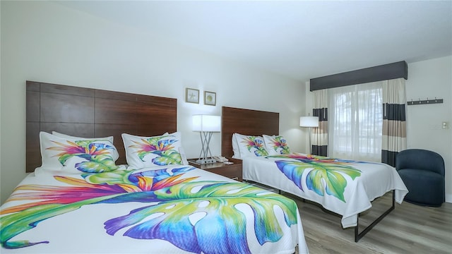 7150 N Tamiami Trl Unit S-600, Sarasota, FL 34243 - bedroom with wood finished floors