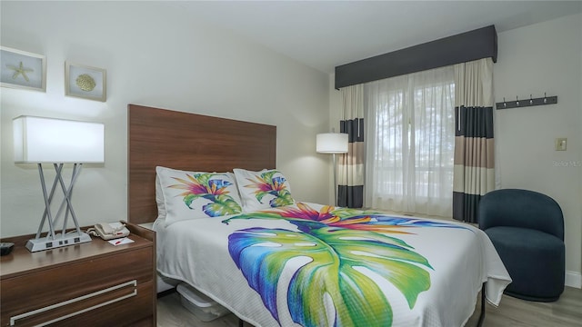 7150 N Tamiami Trl Unit S-600, Sarasota, FL 34243 - bedroom with baseboards and wood finished floors