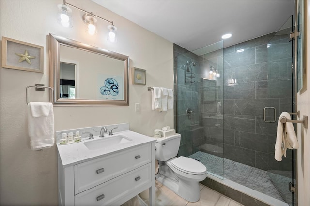 7150 N Tamiami Trl Unit S-600, Sarasota, FL 34243 - bathroom featuring tile patterned flooring, a shower stall, toilet, and vanity