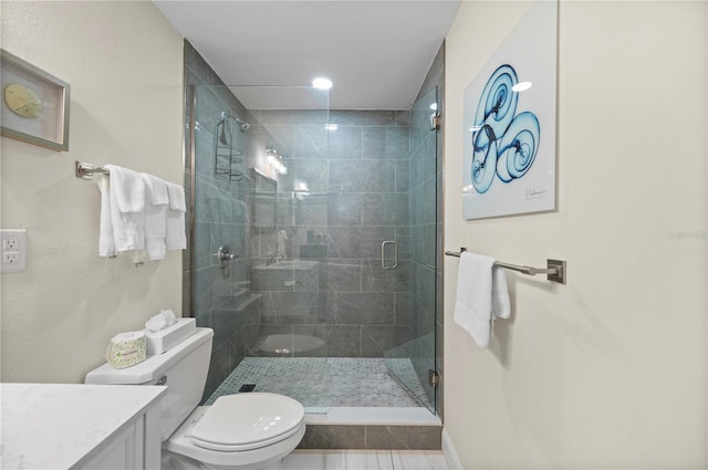 7150 N Tamiami Trl Unit S-600, Sarasota, FL 34243 - bathroom with recessed lighting, vanity, toilet, and a stall shower