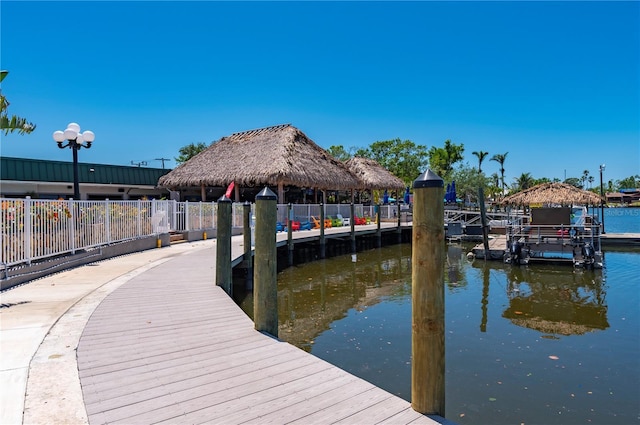 7150 N Tamiami Trl Unit S-600, Sarasota, FL 34243 - dock area featuring a gazebo, a water view, and fence