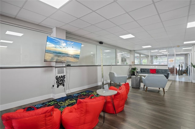 7150 N Tamiami Trl Unit S-600, Sarasota, FL 34243 - rec room with baseboards, wood finished floors, and a drop ceiling