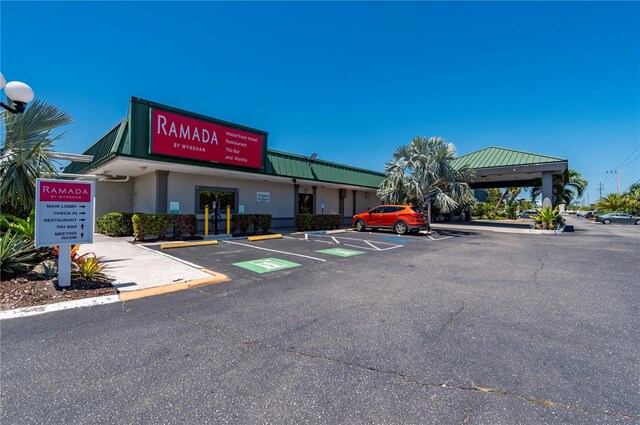 7150 N Tamiami Trl Unit S-600, Sarasota, FL 34243 - view of property featuring uncovered parking