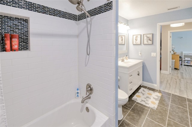 full bathroom featuring tile patterned floors, toilet, shower / washtub combination, vanity, and visible vents