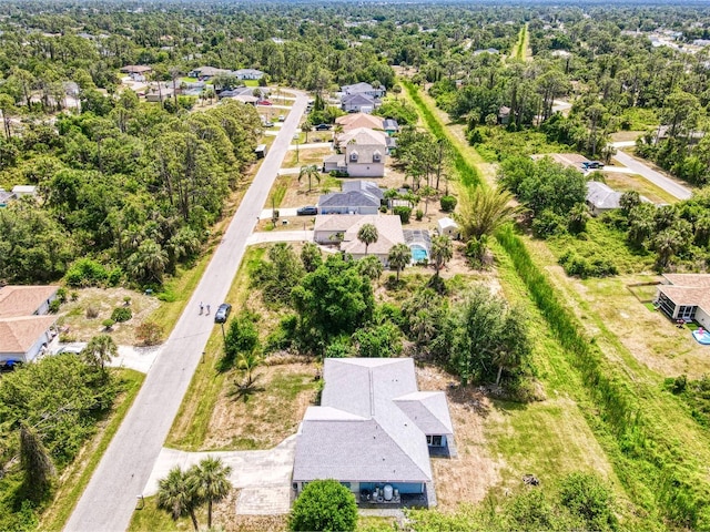 birds eye view of property with a residential view