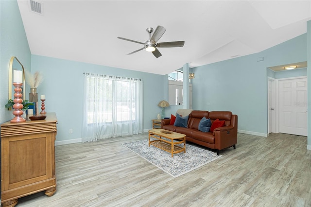 living room with visible vents, baseboards, a ceiling fan, vaulted ceiling, and wood finished floors