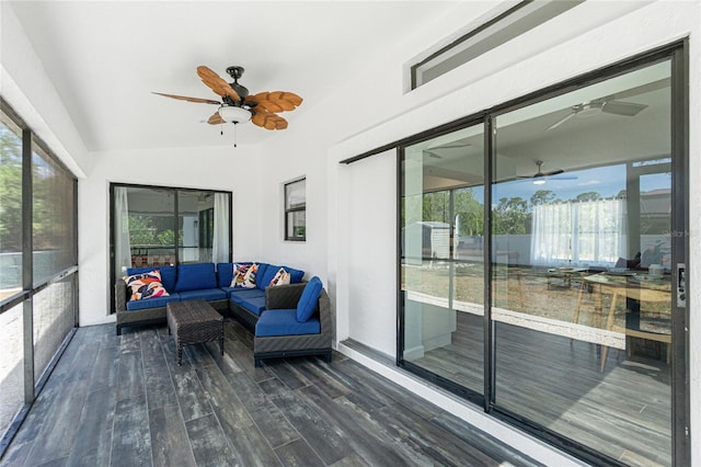 sunroom with an outdoor living space, ceiling fan, and a wealth of natural light