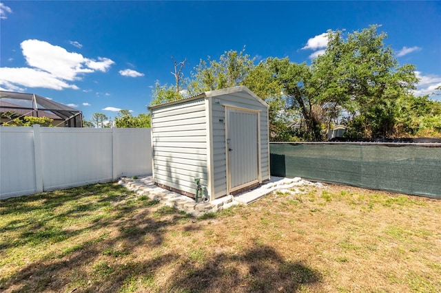 view of shed featuring a fenced backyard