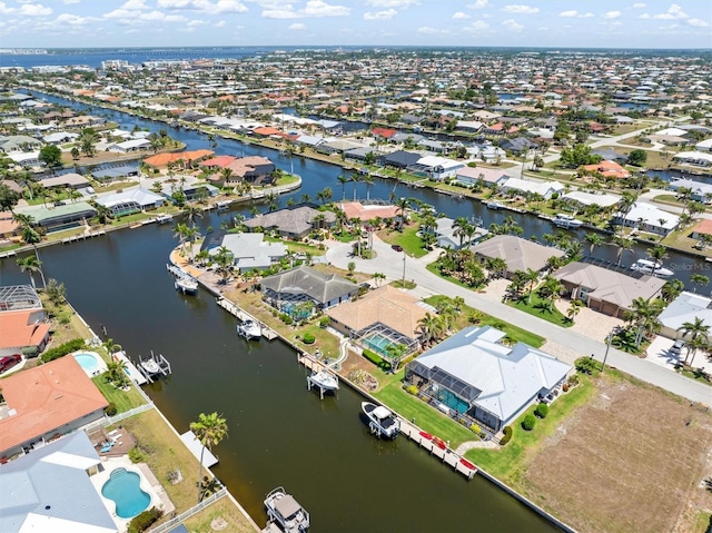 aerial view featuring a residential view and a water view