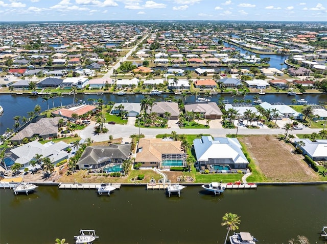 bird's eye view featuring a residential view and a water view