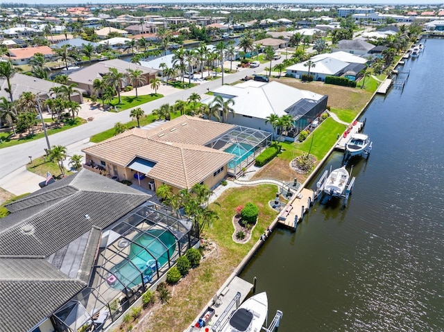 aerial view featuring a water view and a residential view