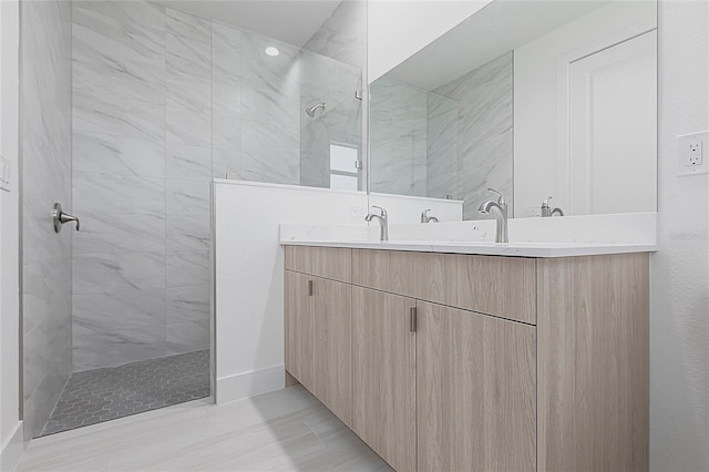 bathroom with double vanity and walk in shower