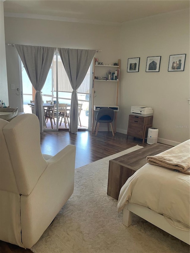 10740 Pearl Bay Cir, Estero, FL 33928 - bedroom featuring crown molding, access to exterior, wood finished floors, and baseboards