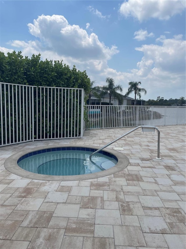 10740 Pearl Bay Cir, Estero, FL 33928 - view of swimming pool featuring fence and a community hot tub
