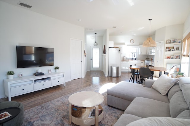 10740 Pearl Bay Cir, Estero, FL 33928 - living room with visible vents and wood finished floors