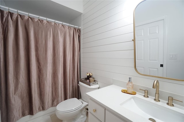 10740 Pearl Bay Cir, Estero, FL 33928 - bathroom with toilet, wood walls, and vanity