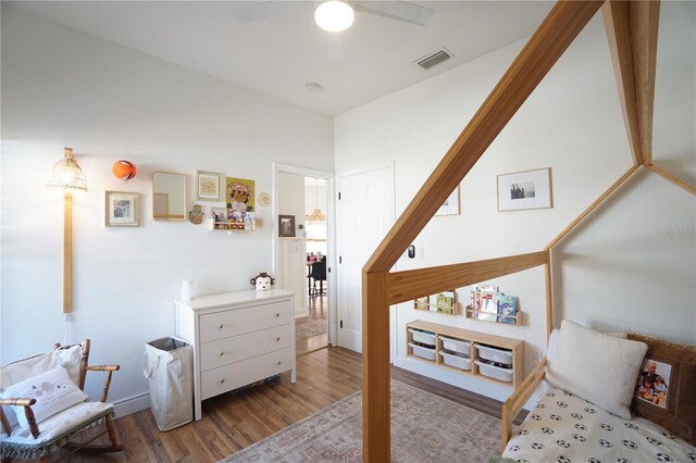 10740 Pearl Bay Cir, Estero, FL 33928 - bedroom with a ceiling fan, visible vents, and wood finished floors