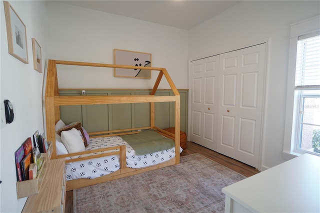 10740 Pearl Bay Cir, Estero, FL 33928 - bedroom featuring wood finished floors, a closet, and multiple windows
