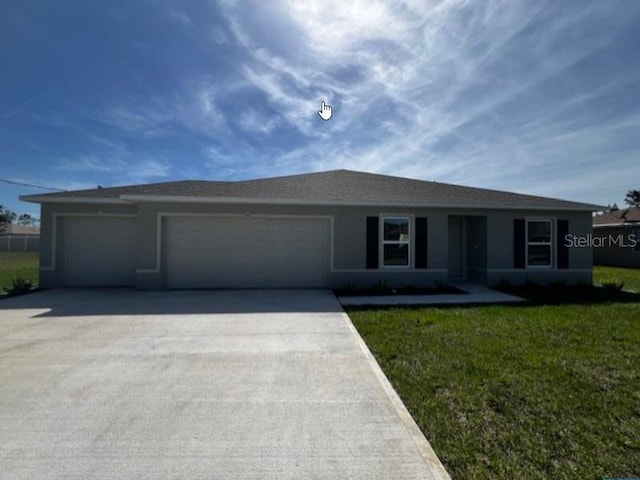 ranch-style house with an attached garage, a front yard, and driveway