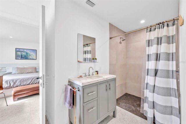 1635 SW Rodgers Ave, Arcadia, FL 34266 - ensuite bathroom featuring vanity, visible vents, a shower with curtain, and connected bathroom