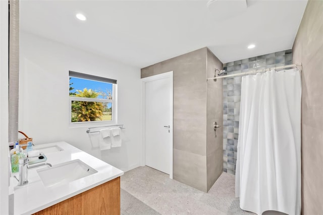 1635 SW Rodgers Ave, Arcadia, FL 34266 - bathroom featuring recessed lighting, a tile shower, a sink, and speckled floor