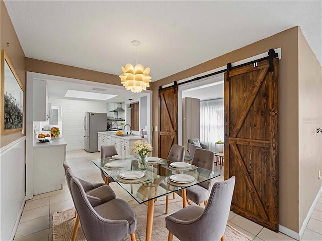 3561 Middletown St, Port Charlotte, FL 33952 - dining area with a barn door and light tile patterned floors