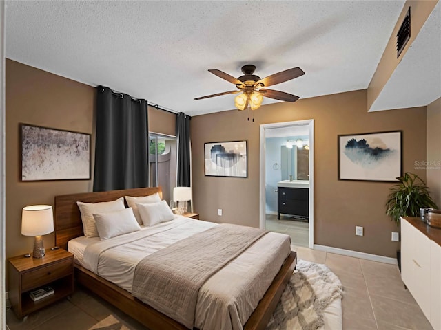 3561 Middletown St, Port Charlotte, FL 33952 - bedroom with light tile patterned floors, connected bathroom, a textured ceiling, and ceiling fan