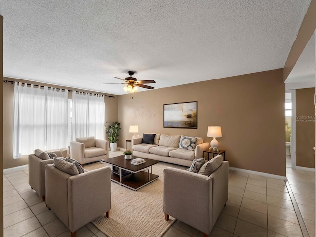 3561 Middletown St, Port Charlotte, FL 33952 - living area featuring plenty of natural light, ceiling fan, light tile patterned floors, and a textured ceiling