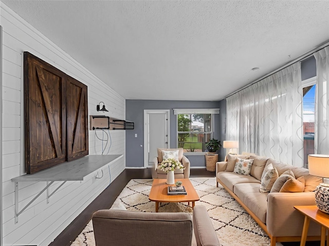3561 Middletown St, Port Charlotte, FL 33952 - living area with plenty of natural light, wood finished floors, a textured ceiling, and wood walls