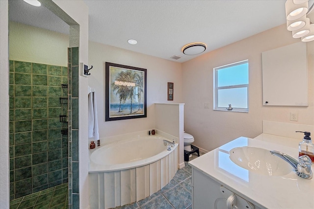 full bath with vanity, tile patterned floors, toilet, visible vents, and a garden tub
