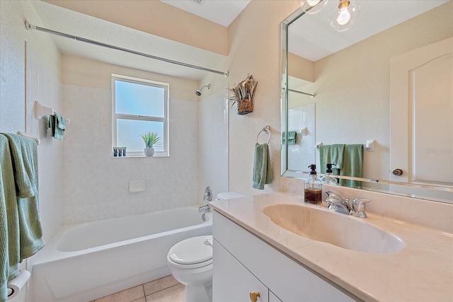 bathroom featuring tile patterned floors, toilet,  shower combination, and vanity