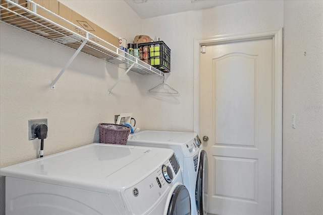 washroom featuring independent washer and dryer and laundry area