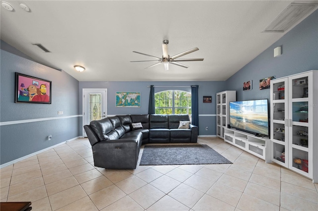 1773 Portage St, North Port, FL 34287 - living area with ceiling fan, visible vents, vaulted ceiling, light tile patterned floors, and baseboards