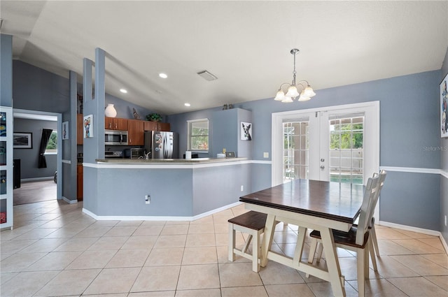 1773 Portage St, North Port, FL 34287 - kitchen featuring visible vents, french doors, appliances with stainless steel finishes, a notable chandelier, and vaulted ceiling