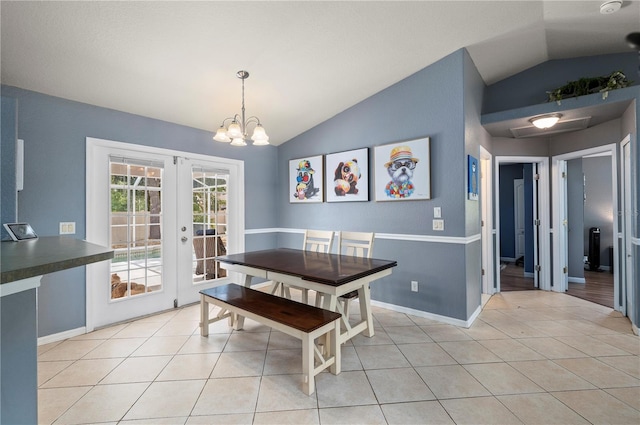 1773 Portage St, North Port, FL 34287 - dining area featuring an inviting chandelier, lofted ceiling, light tile patterned flooring, baseboards, and french doors