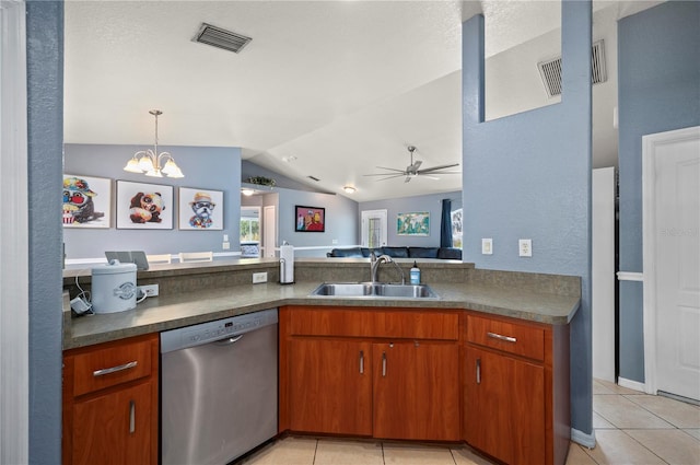 1773 Portage St, North Port, FL 34287 - kitchen featuring dark countertops, dishwasher, a sink, light tile patterned floors, and lofted ceiling