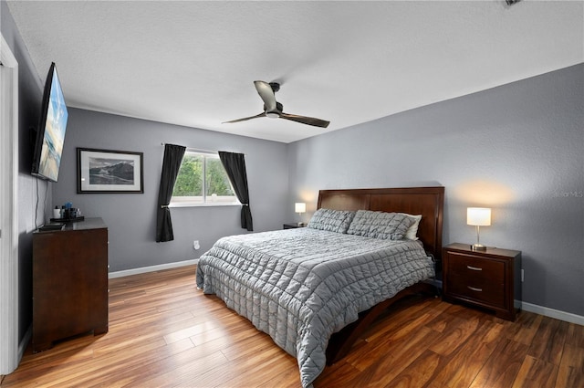 1773 Portage St, North Port, FL 34287 - bedroom with baseboards, a ceiling fan, and wood finished floors