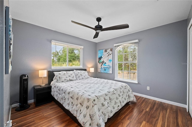 1773 Portage St, North Port, FL 34287 - bedroom featuring ceiling fan, baseboards, multiple windows, and wood finished floors
