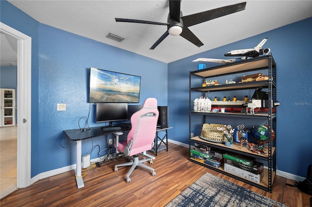 1773 Portage St, North Port, FL 34287 - office featuring baseboards, a ceiling fan, a textured wall, and wood finished floors