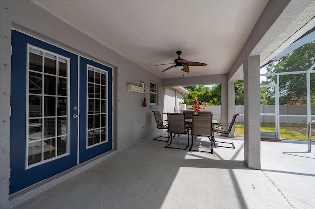 1773 Portage St, North Port, FL 34287 - view of patio featuring a lanai, fence, a ceiling fan, and outdoor dining space