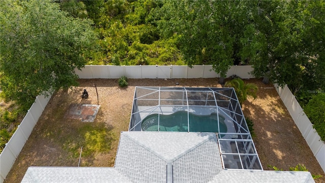1773 Portage St, North Port, FL 34287 - view of swimming pool with glass enclosure and a fenced backyard