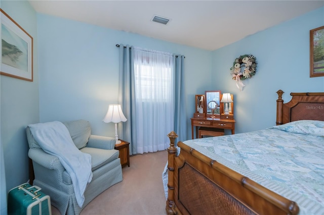 bedroom with light carpet and visible vents