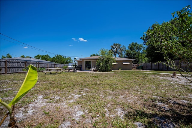view of yard featuring a fenced backyard and a patio area