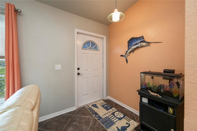 3175 Lakatos St, North Port, FL 34286 - foyer entrance featuring baseboards and dark tile patterned flooring